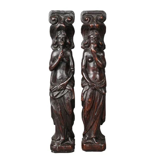 A PAIR OF 17TH CENTURY STYLE OAK FIGURAL TERMS (2).