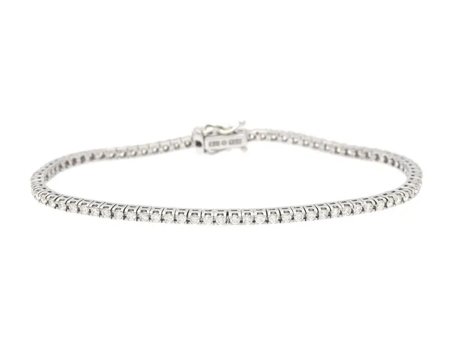 TENNISARMBAND, 18K vitguld, 82 briljantslipade diamanter ca 1,62 ctv, ca W-TCa/VVS-VS, längd 17 cm, vikt 8,7 g,