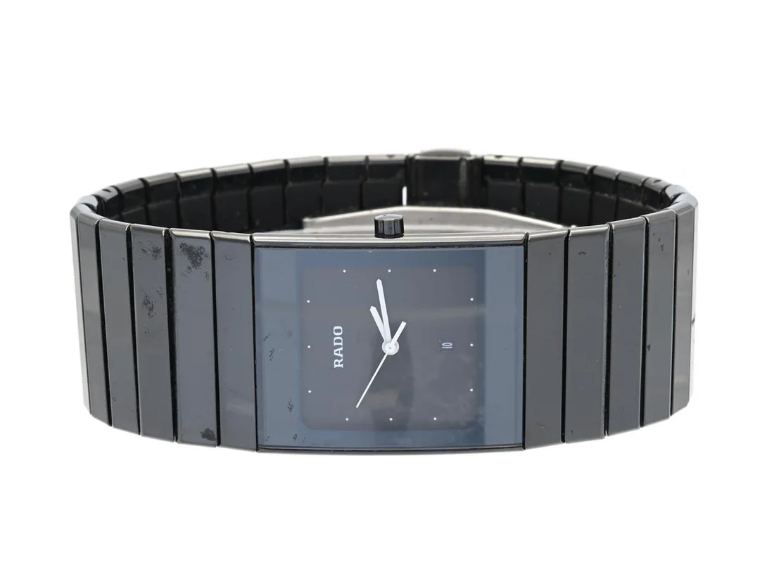 RADO, DiaStar, Ceramica, Serie nr. 34954004, herrur, 27 x 32 mm, high-tech ceramica, quartz, safirglas, datum, defekt (går ej, akut servicebehov), integrerad originallänk, viklås, Ref nr. 03984, cert (ej komplett), ca juni 1992, box (skadad). — Klockor/Rado — Kaplans