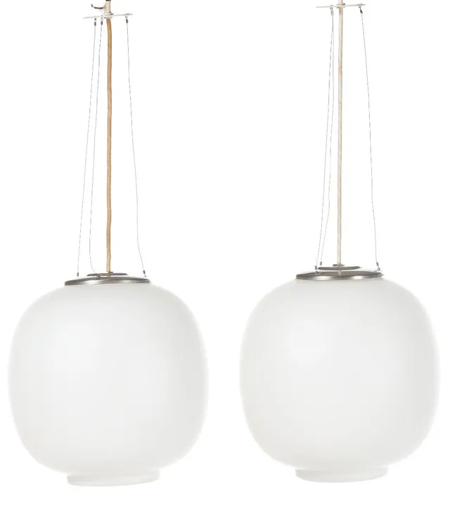 “Radiohuspendel”. A pair of matte opaline glass pendants with nickled metal mounting for wire hanging. Manufactured by Louis Poulsen. H. incl. mounting 34. Diam. app. 32 cm. (2)