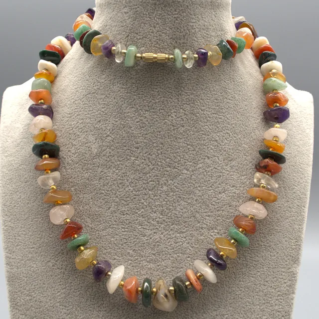 EDELSTEINMIXCOLLIER, POLIERTE SCHEIBEN, TRENNPERLEN AUS MESSING, UM 1950, MIT SCHRAUBVERSCHLUSS CA. 73 CM.
