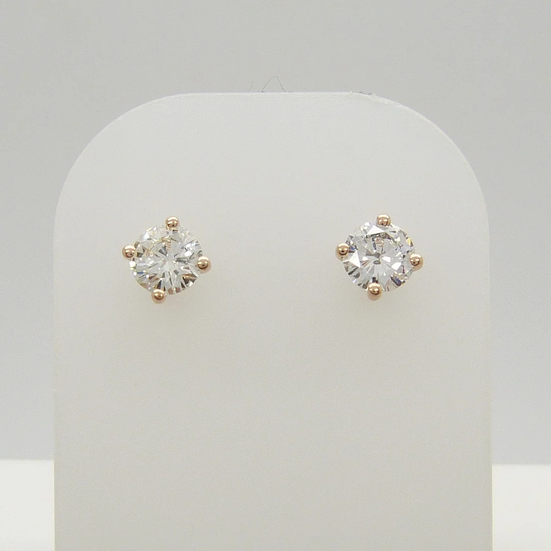 0.73ct DIAMOND ROSE GOLD STUDS. — Earrings — Rumsey’s Auctioneers