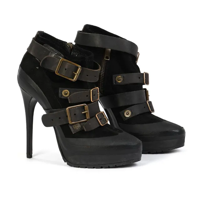 A pair of black suede wedge-heel stilettos with leather buckles and rubber soles. Heel height app. 13 cm. Size 39.5. (2)