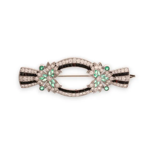 Art Deco diamonds, emeralds and onyx brooch, circa 1925.