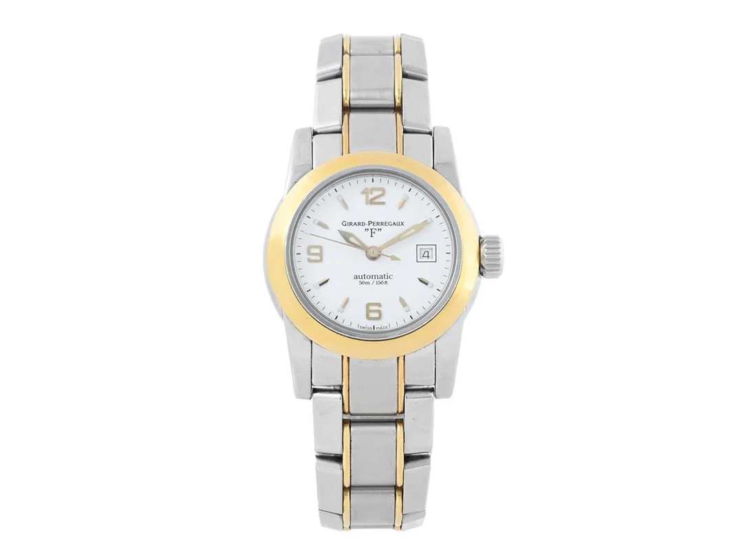 GIRARD-PERREGAUX, "F" (50m/150ft), Cal E 0500 (ETA 2671), Serie nr. 92, Ref nr. 8039, damur, 29 mm, stål/guld, automatisk, safirglas, datum, originallänk, viklås, cert (ej komplett), ca december 2006, box, ytterkartong. — Klockor/Girard-Perregaux — Kaplans
