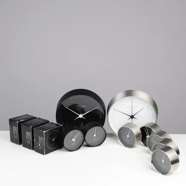 HENNING KOPPEL. Collection of three wall clocks, three thermometers, two barometers and a hygrometer, stainless and black lacquered steel, Georg Jensen, Denmark, (9).