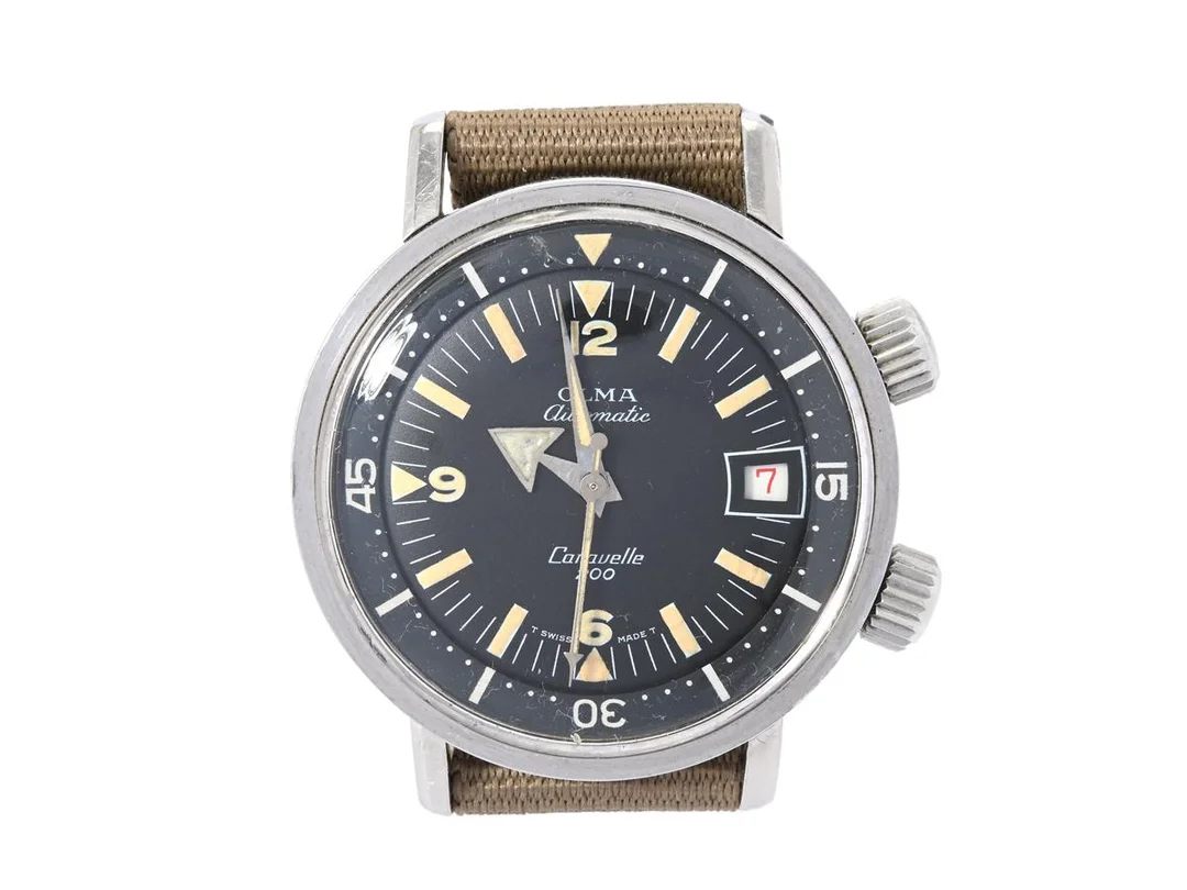 OLMA, Caravelle 200 (T Swiss Made T), "Super Compressor", Cal AS 1902/03, Boett nr. 0748/3 / 768, herrur, 36 mm, stål, automatisk, plexiglas, datum, renoverad timvisare, skadad urtavla, vridbar innerring, NATO-band, ca 1965. — Klockor/Olma — Kaplans