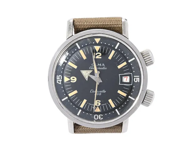 OLMA, Caravelle 200 (T Swiss Made T), "Super Compressor", Cal AS 1902/03, Boett nr. 0748/3 / 768, herrur, 36 mm, stål, automatisk, plexiglas, datum, renoverad timvisare, skadad urtavla, vridbar innerring, NATO-band, ca 1965.