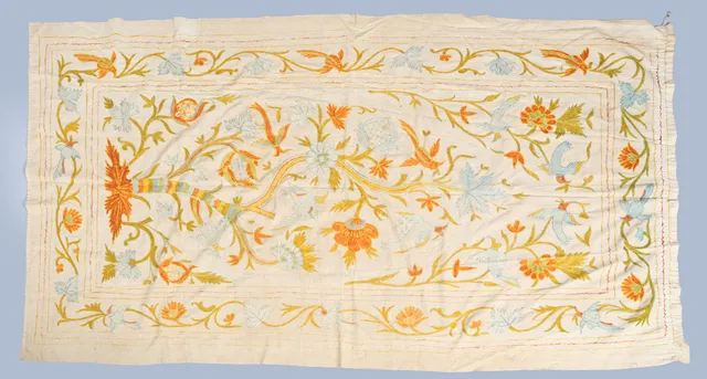 A CREWELWORK EMBROIDERED PANEL.