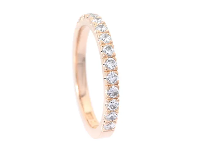 ALLIANSRING, 18K guld, briljantslipade diamanter ca 0,60 ctv, ca TCr-TCa/SI-P, stl 18,5 mm, vikt 4,1 g.