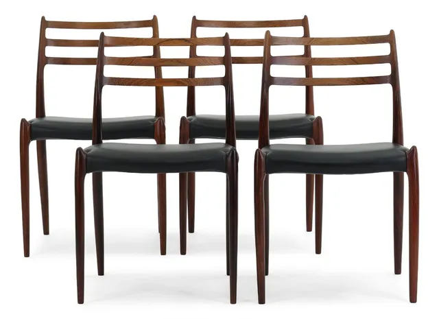 Set of four chairs in rosewood. Seat upholstered in black leather. Model 78. Designed 1962. Manufactured by J.L. Møller, Højbjerg. (4)