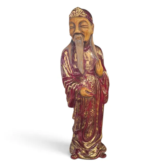 Figura de sabio oriental en porcelana.