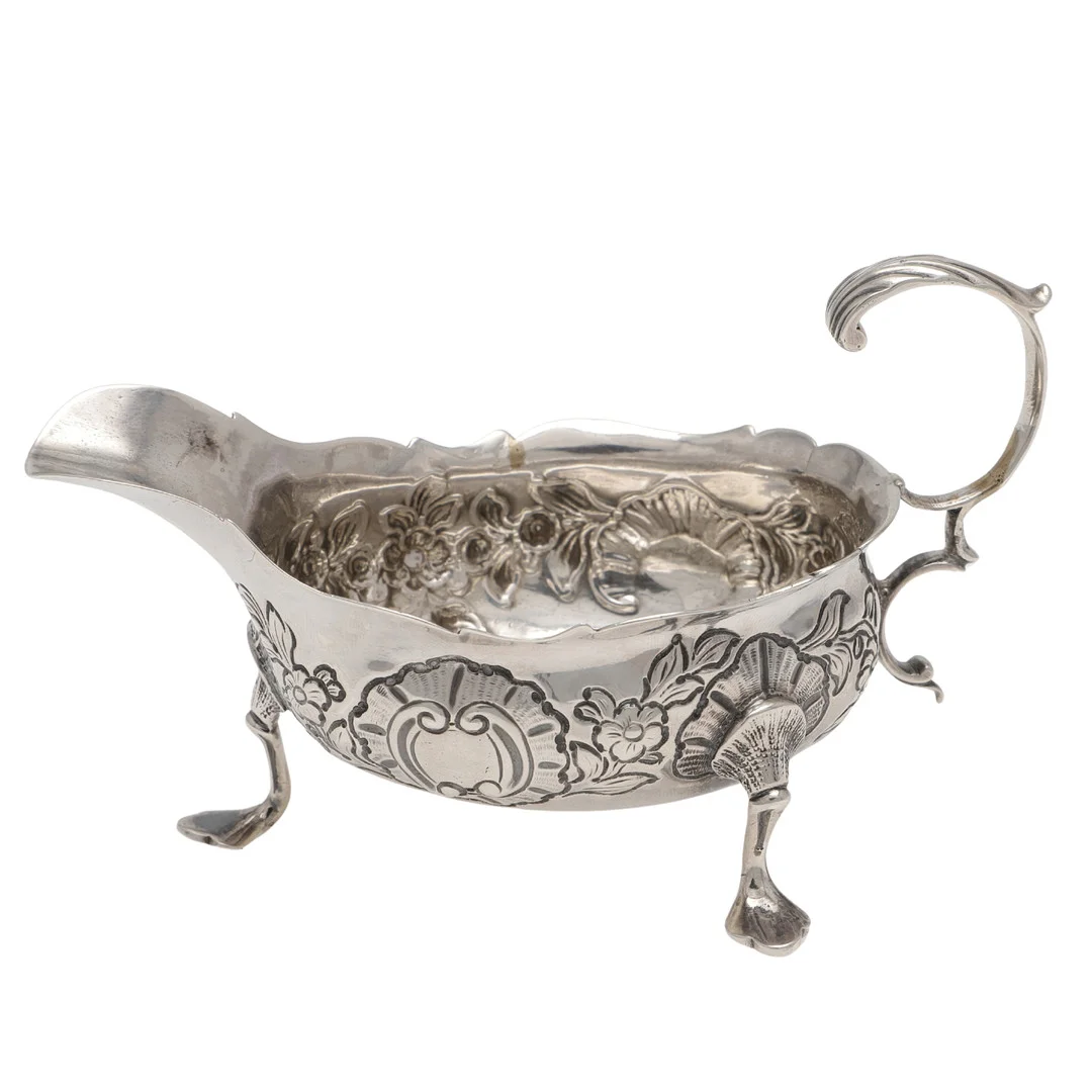 A GEORGE III SILVER SAUCE BOAT. — Silver — Lawrences Auctioneers