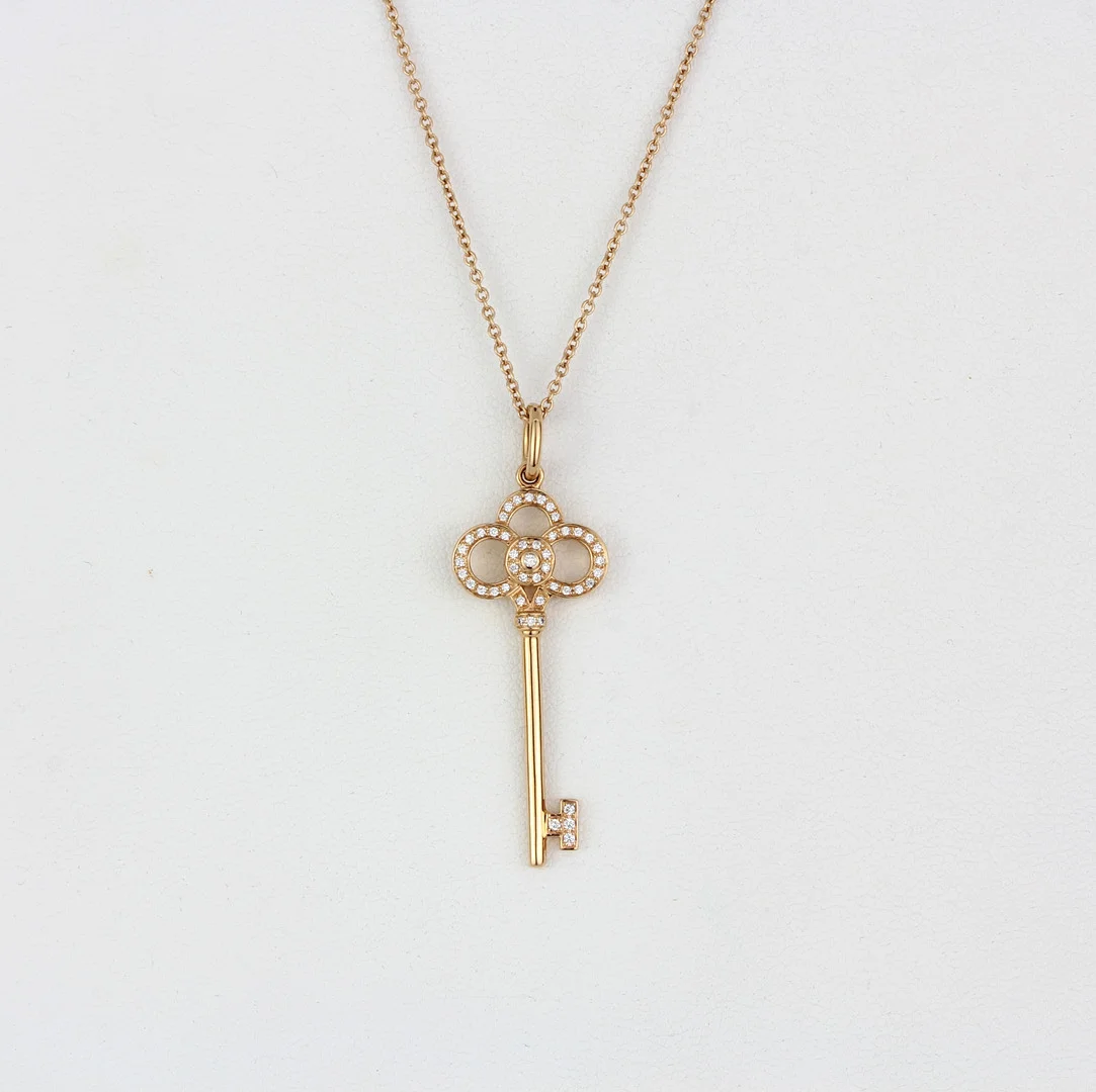 18CT TIFFANY & CO DIAMOND PENDANT AND CHAIN. — Necklace — Chalkwell Auctions