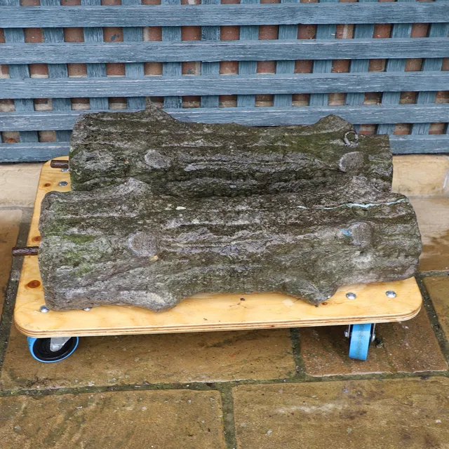 A PAIR OF STONE CARVED FAUX BOIS POSTS.