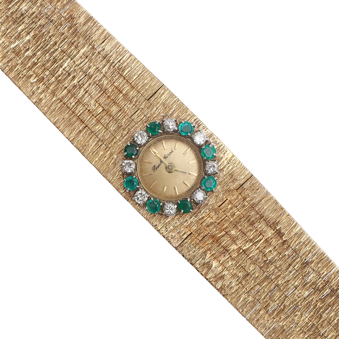 A LADY'S EMERALD, DIAMOND AND 9CT GOLD WRISTWATCH BY BUECHE GIROD. — Wristwatches — Lawrences Auctioneers