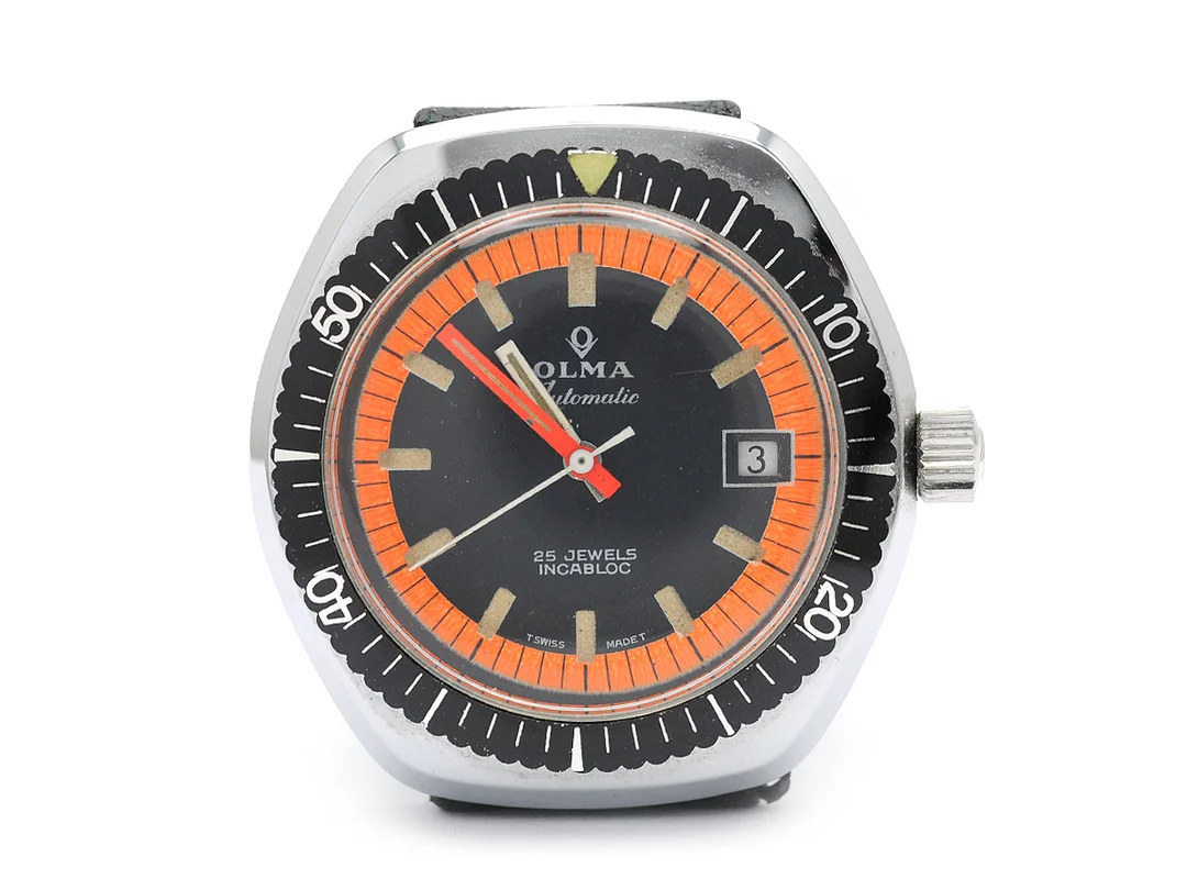 OLMA, herrur, 37,5 mm, Cal ETA 2783, Boett nr. 678, vitmetall, automatisk, plexiglas, datum, skadad urtavla, defekt, gummiband, ca 1970. — Klockor/Olma — Kaplans