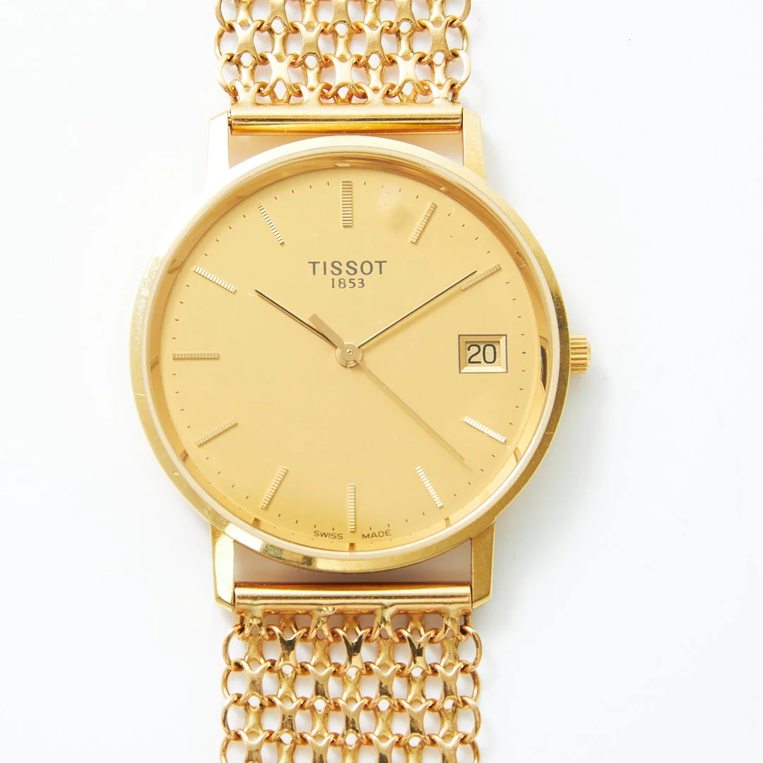 TISSOT, armbandsur, quartz, datum, armband, 18 k guld, x-länk, Styletta Guldvaru AB, Stockholm 1968. — Wristwatches — Stockholms Auktionsverk Magasin 5