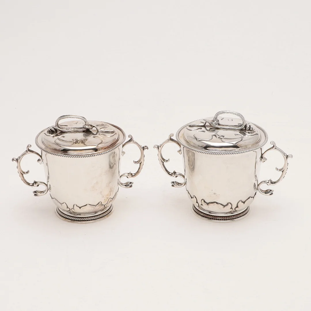 A PAIR OF EDWARDIAN BRITANNIA-STANDARD TWO-HANDLED CUPS & COVERS. — Silver — Lawrences Auctioneers