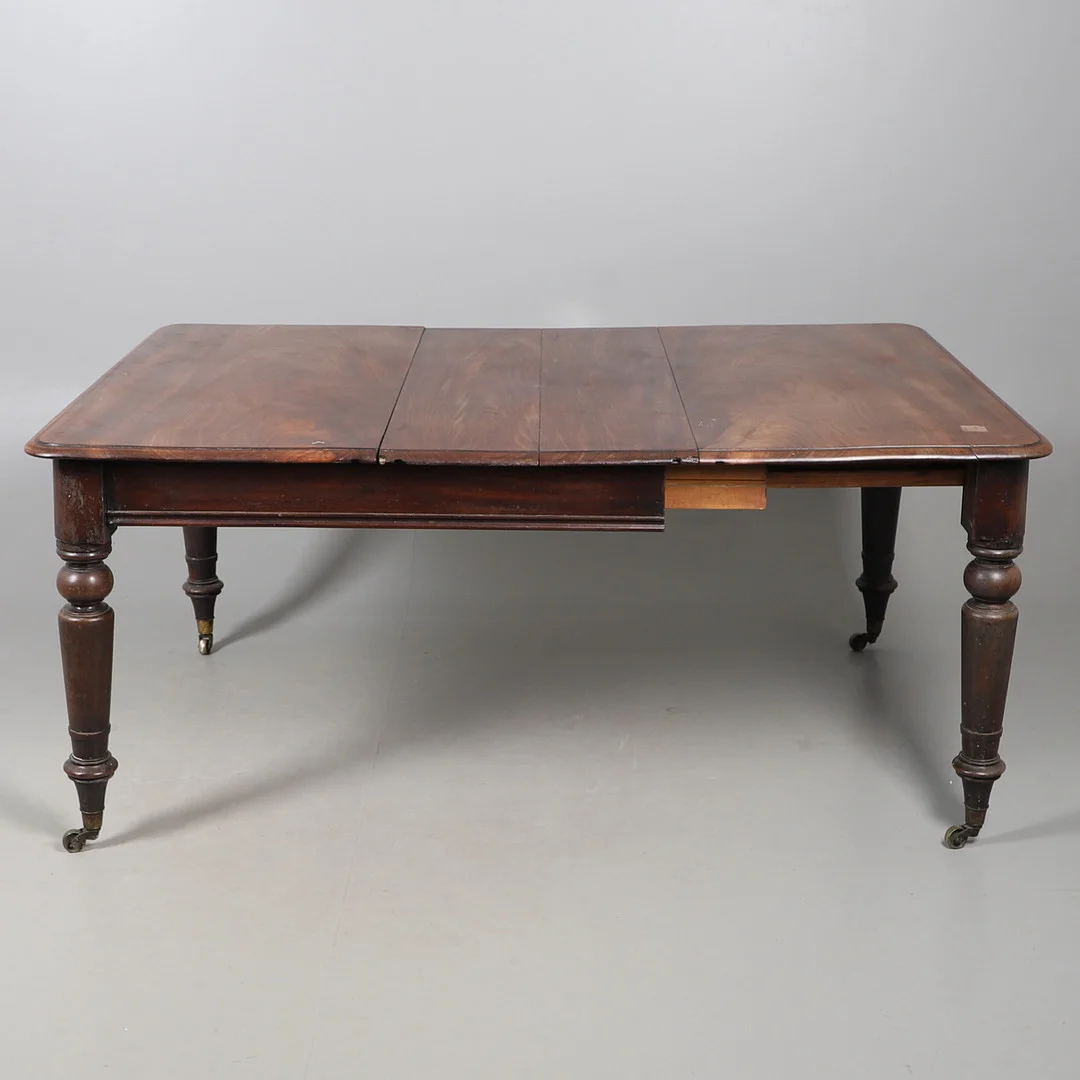 A 19TH CENTURY MAHOGANY EXTENDING DINING TABLE. — Dining tables — Lawrences Auctioneers