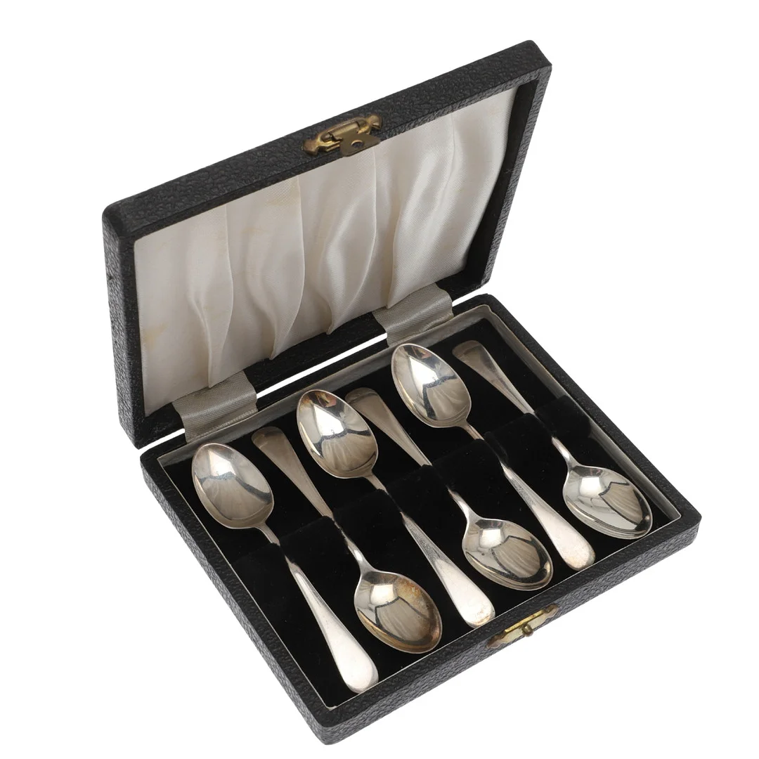 A CASED SET OF SIX MID CENTURY SILVER OLD ENGLISH PATTERN TEASPOONS. — Silver — Lawrences Auctioneers