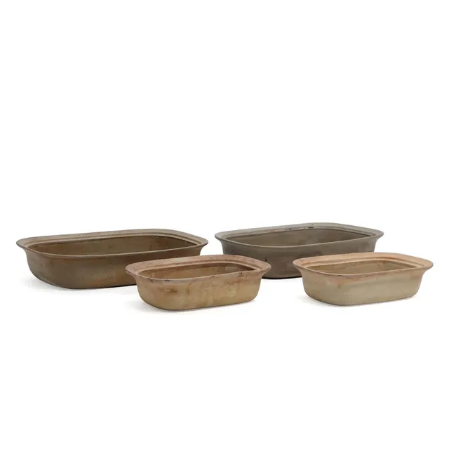 “Ildpot”. Four unglazed stoneware pans. Stamped with monogram, Royal Copenhagen, no. 22531 and 22528. H. 5–6. L. 20.5–29 cm. (4)