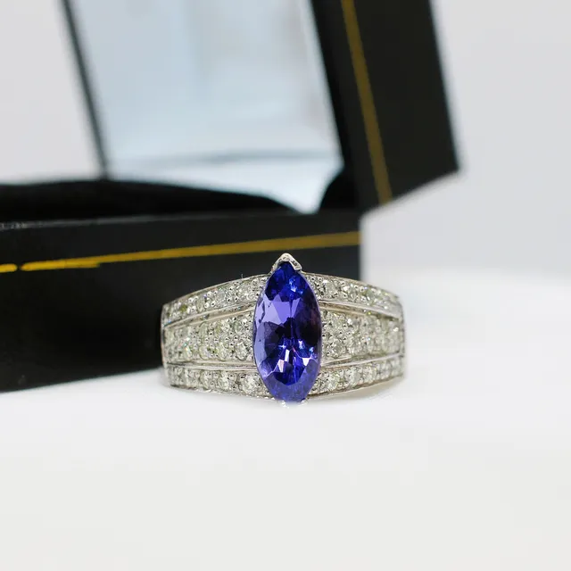 TANZANITE & DIAMOND 18K RING.