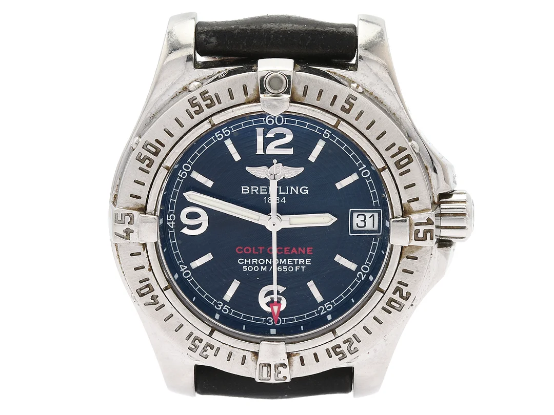 BREITLING, Colt Oceane (500 M/1650 FT), Chronometre, Cal 77, Verk nr. 866120, Serie nr. 866120, Ref nr. A77380, Boett nr. 2505 B5, damur, 33,2 mm, stål, SuperQuartz, safirglas, datum, skadad urtavla, defekt, läderband, originalspänne, ca 2005, serviceetui. — Klockor/Breitling — Kaplans