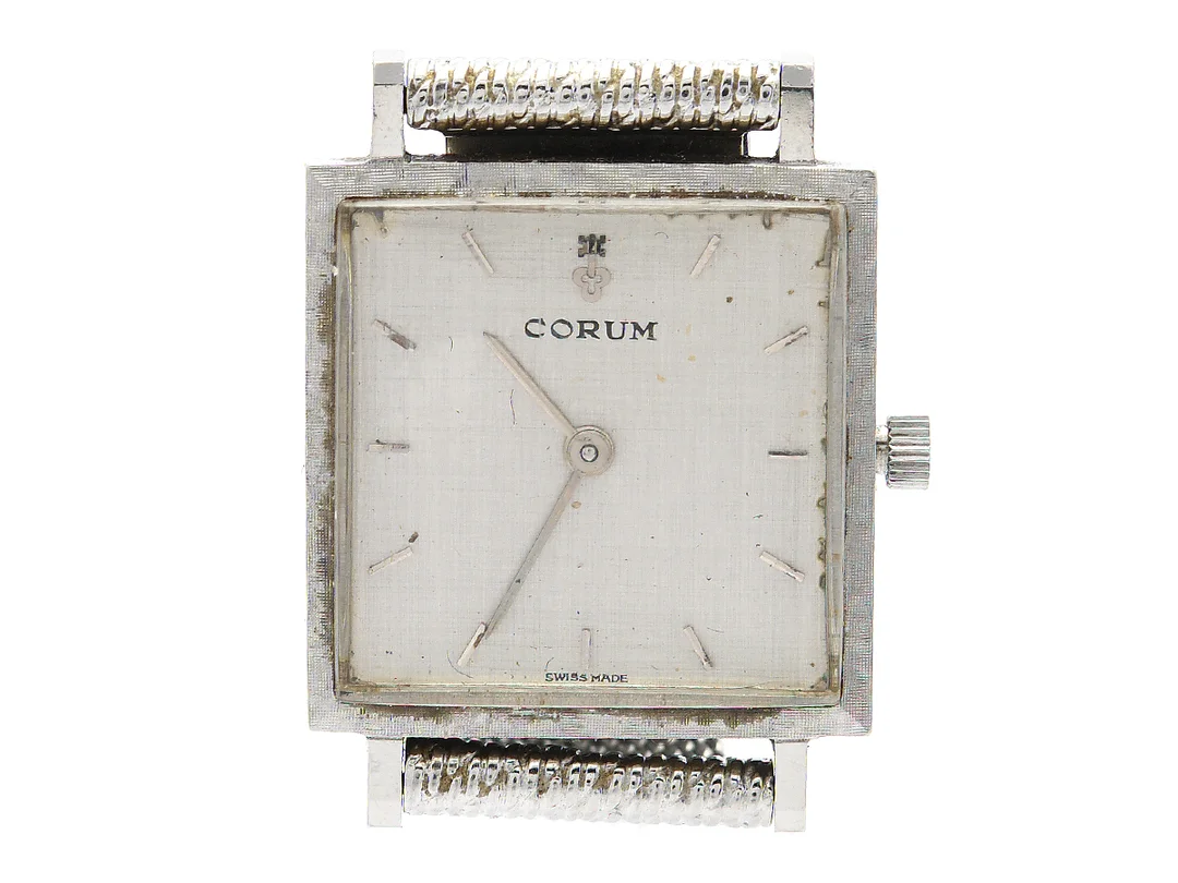 CORUM, damur, 21,5 x 21,5 (29,5) mm, Verk 53875, Boett nr. 26 158 / 20 4, stål, manuell, plexiglas, skadad urtavla, ca 1965, metallänk ej original. — Klockor/Corum — Kaplans