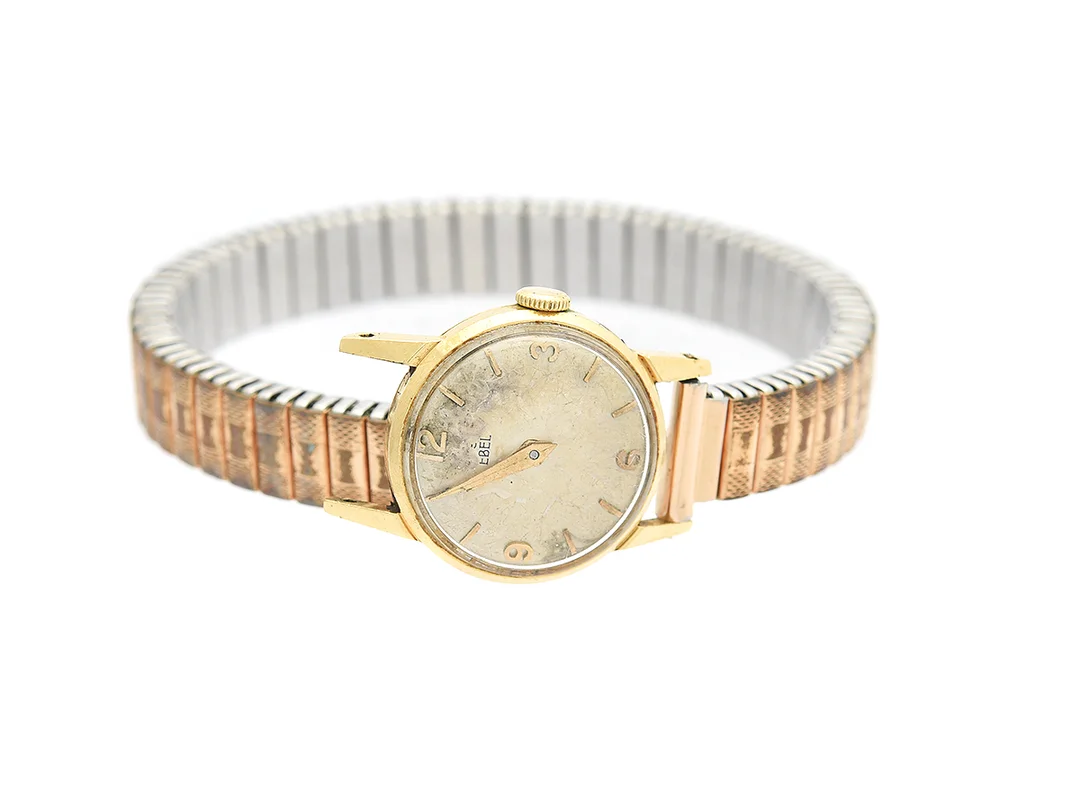 Eterna, damur, Ø17mm, 18K i boett, manuell, plastglas, flexlänk, skadad urtavla, går ej, skadad länk — Klockor/Eterna — Kaplans