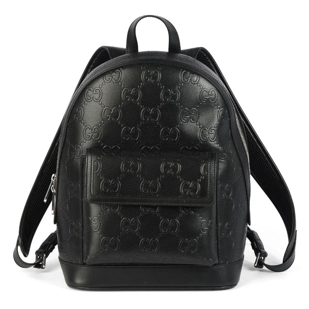 A backpack in black monogram leather with silver tone hardware, short handle, two adjustable straps, an external front pocket, a zip compartment with an internal zip pocket and beige fabric lining. H. 35 x W. 27 x D. 14 cm. — Designer Handbags & Fashion/Designer Handbags — Bruun Rasmussen