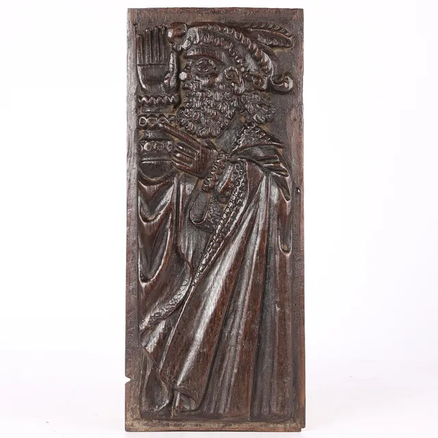 AN ELIZABETH I LATE 16TH CENTURY CARVED OAK PANEL.