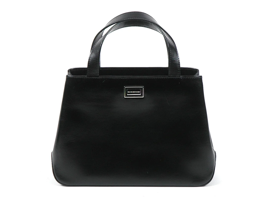VÄSKA, BURBERRY 37x19x8 cm svart läder dustbag — Accessoarer/Väskor — Kaplans