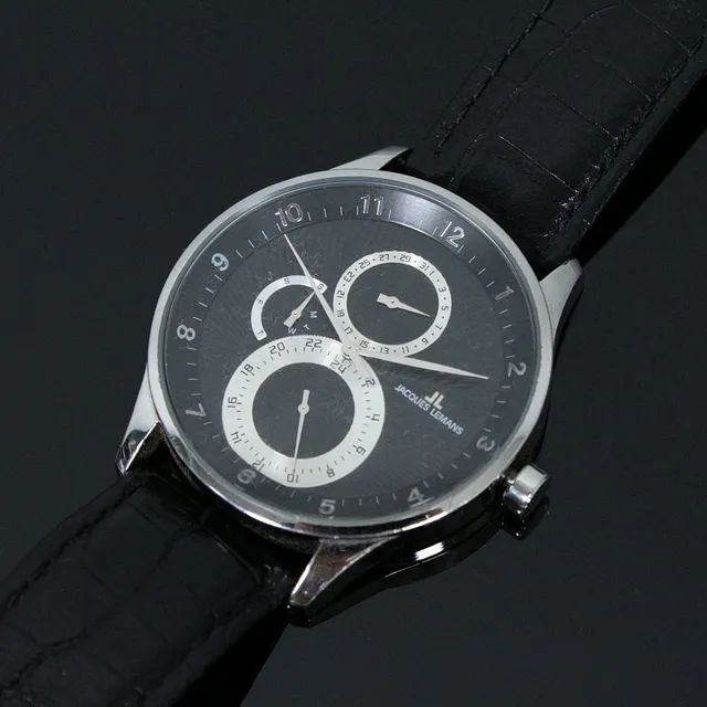 JACQUES LEMANS. Herrenarmbanduhr.
