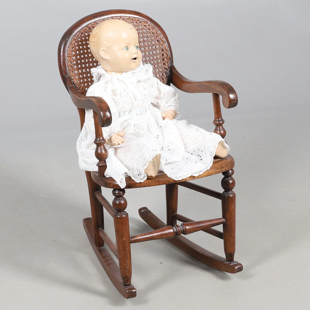 A VICTORIAN BEECH CHILD'S ROCKING CHAIR AND DOLL. — Armchairs & Chairs — Lawrences Auctioneers
