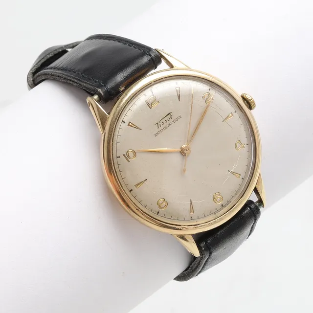 ARMBANDSUR, 14 K guld. Tissot Antimagnetique. Manuel. 1950-tal.
