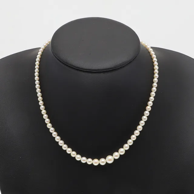 A STRING OF CIRO GRADUATED CULTURED PEARLS WITH PLATINUM CLASP.