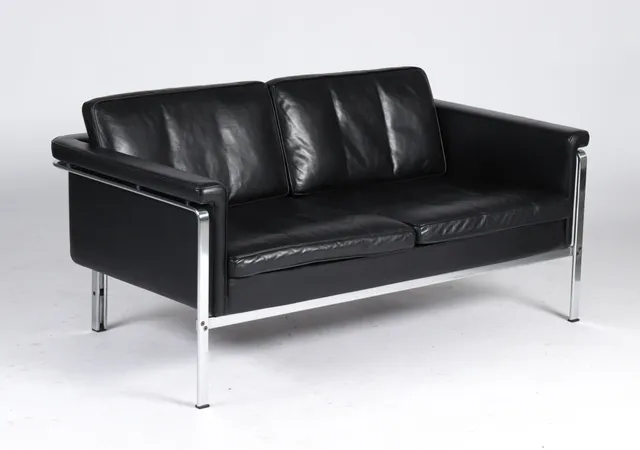 Horst Brüning. Freestanding two-seater vintage sofa, model 6912, black patinated leather