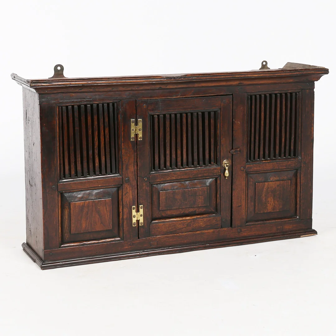 AN ELM SPINDLE MURAL CUPBOARD IN THE 18TH CENTURY MANNER. — Cupboards, Cabinets & Shelves — Bishop & Miller