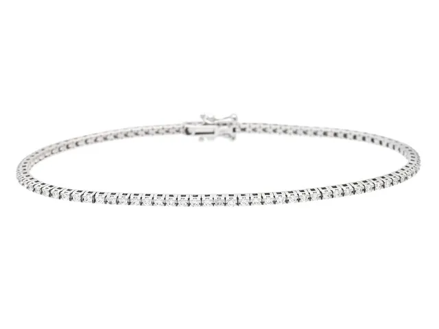 TENNISARMBAND, 18K vitguld, 91 briljantslipade diamanter ca 0,96 ctv, ca TW-Cr/VS-SI, längd 18 cm, vikt 6,5 g, en diamant med skada.