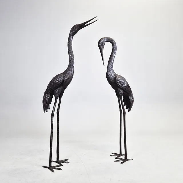 A PAIR OF CONTEMPORARY BRONZE SCULPTURES OF CRANES.