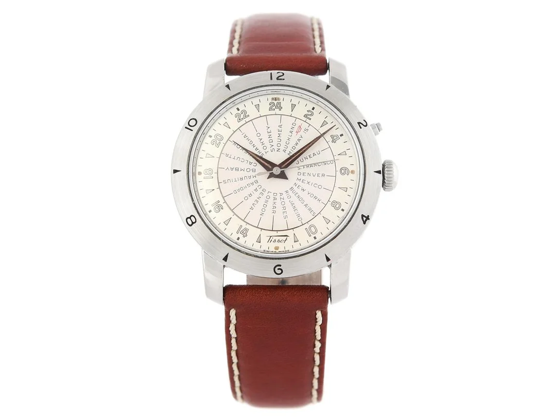 TISSOT, Navigator (Swiss Made), World Time, Cal 28,5 N-21T, Serie nr. 2799076, Ref nr. 4002-1, herrur, 36 mm, stål, hammarautomat, plexiglas, 24-timmarsvisning, världstider, läderband, ca 1952. — Klockor/Tissot — Kaplans