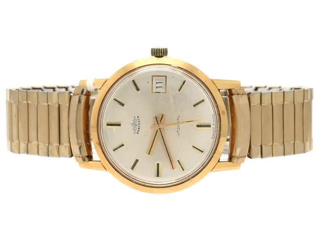 Perfecta, automat, 18K, 33mm, datum, gravyr, med flexiarmband i förgyllt stål