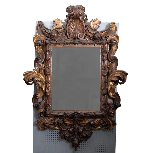 Large mirror with Baroque style frame in carved and gilt wood, second half of the 18th Century.