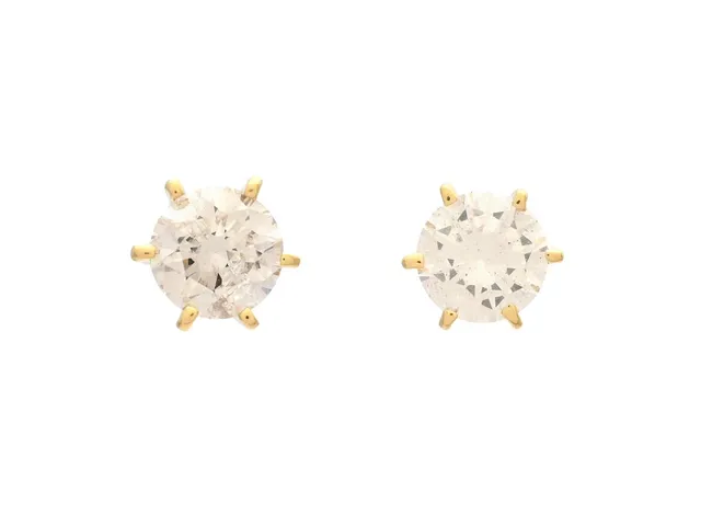 ENSTENSÖRHÄNGEN, 18K guld, briljanter ca 0,80 ctv, ca W/P2, vikt 1,2 g, ena diamanten är mjölkig, ena diamanten med natural på rondisten och inneslutning som når ytan, nagg på kuletterna.
