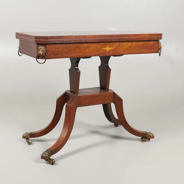 AN INLAID REGENCY ROSEWOOD AND SATINWOOD CARD TABLE.