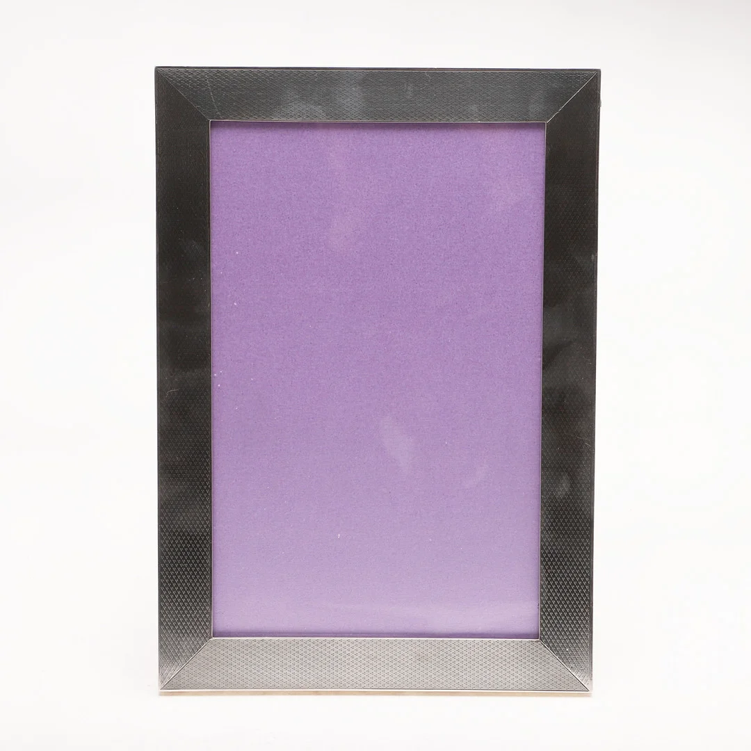 A GEORGE V BRITANNIA-STANDARD MOUNTED PHOTOGRAPH FRAME. — Silver — Lawrences Auctioneers
