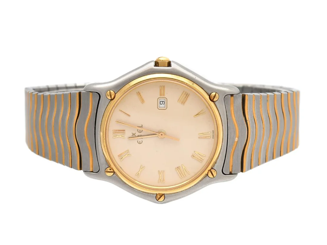 EBEL, Sport Classic, Senior, Serie nr. 19062110, Boett nr. 183903, herrur, 34 mm, stål/guld, quartz, safirglas, datum, skadad urtavla, integrerad originallänk, viklås, Ref nr. 0292, cert, februari 1993. — Klockor/Ebel — Kaplans