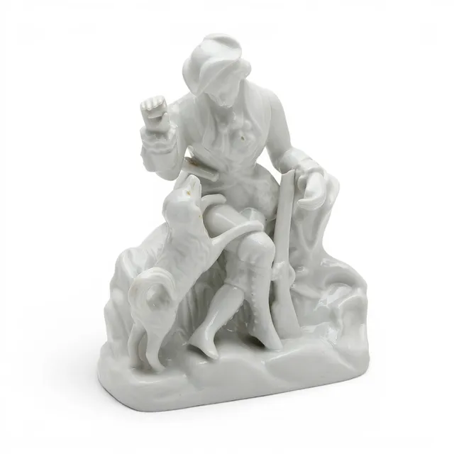 "Hunter with a dog", glazed porcelain figure by Santa Clara, 20th Century.