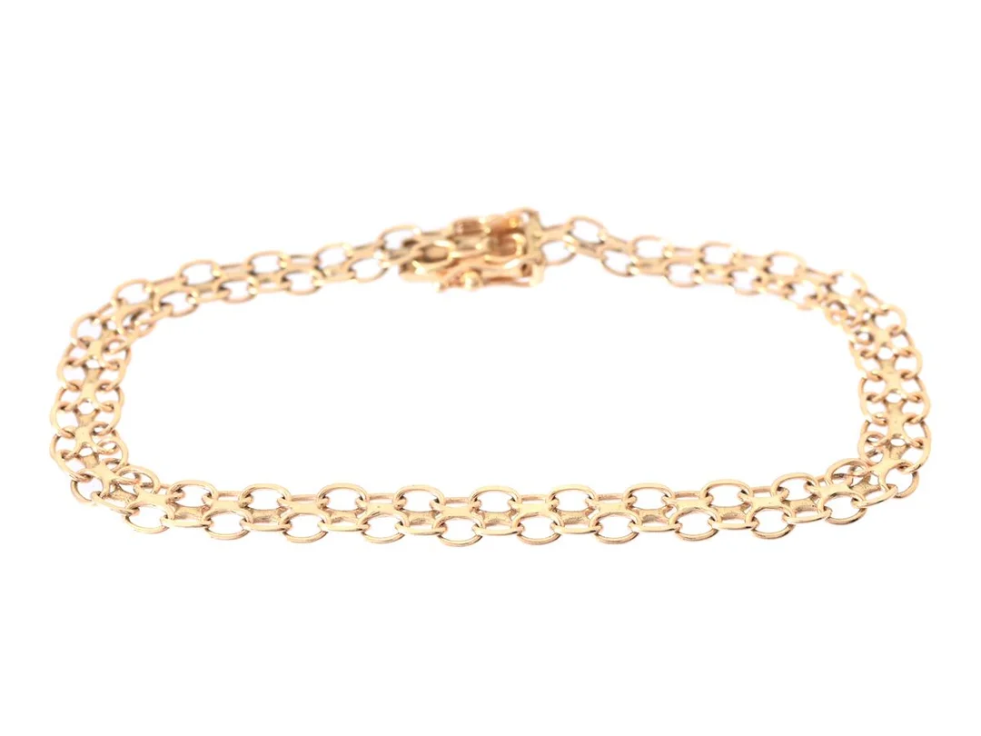 ARMBAND, 18K guld, x-länk, längd 17 cm, kistlås, säkerhetsåttor, vikt ca 5,6 g. — Smycken/Armband — Kaplans